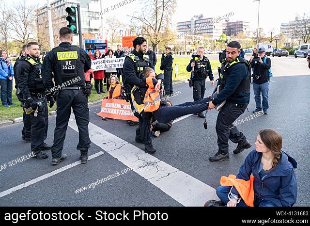 Berlin, Germany, Europe - Climate protesters of the so-called Last Generation (Letzte Generation) have glued themselves to a roadway of a main street at...