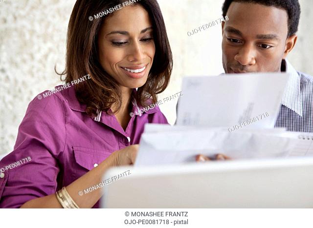 Couple opening mail together