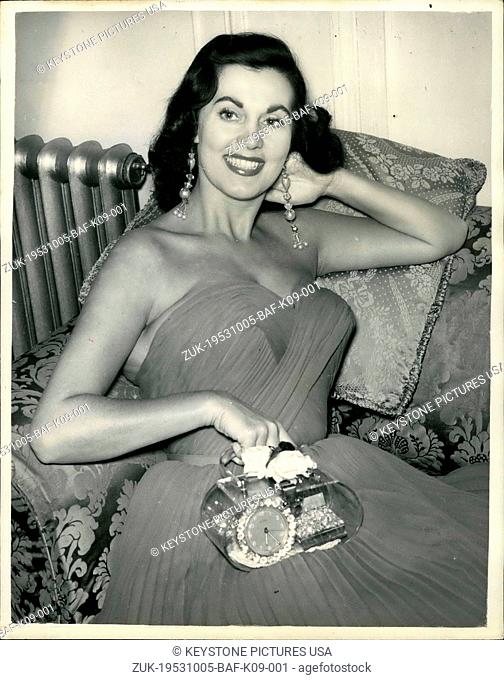 Oct. 05, 1953 - American cabaret star sports unique handbag. Miss Betty George with her Alarum clock. Photo shows American cabaret star Miss Betty George caused...
