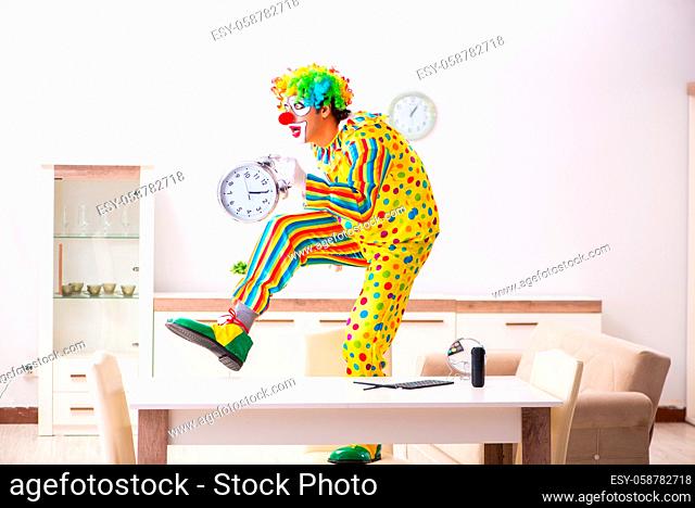 Male clown preparing for perfomance at home