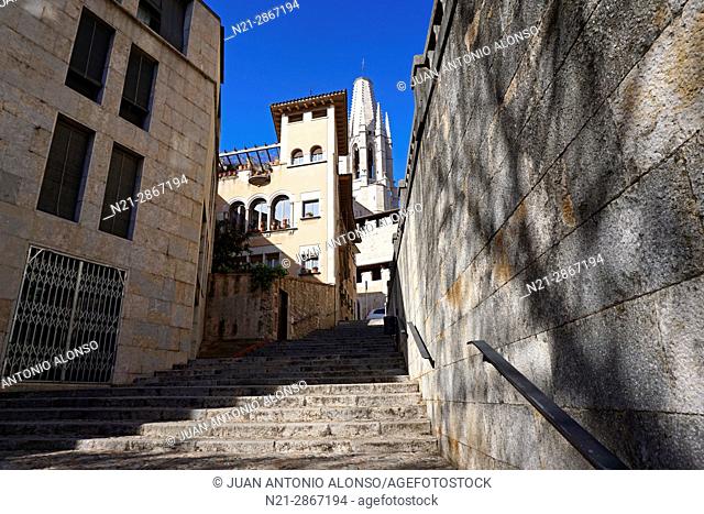 Stairs leading to the Pujada -the slope- de Sant Feliu. The tower of the Church of Sant Feliu can be seen in the background