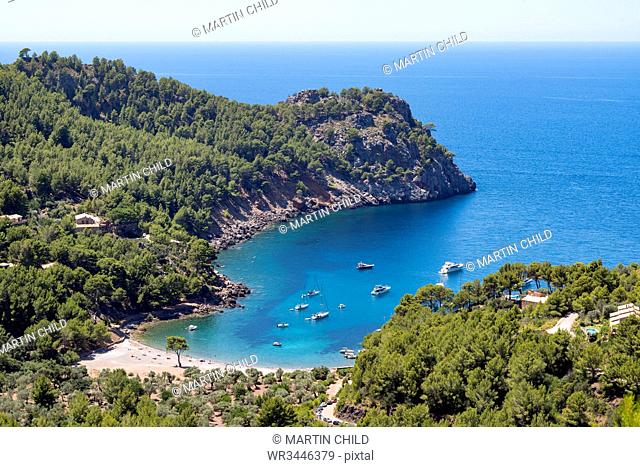 The secluded bay of Cala Tuent on the rugged north west coast of the Mediterranean island of Mallorca, Balearic Islands, Spain, Europe