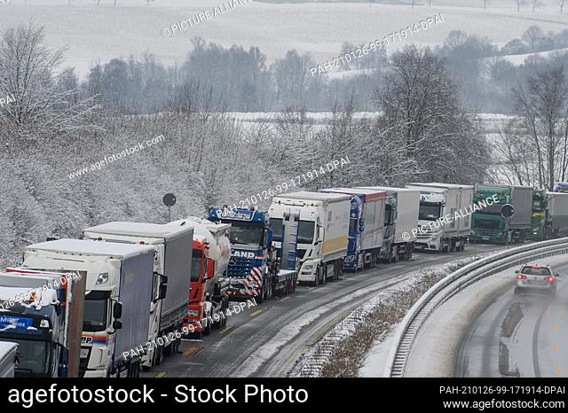 26 January 2021, Lower Saxony, Kalefeld: Trucks are backed up on the A7 motorway between the Seesen and Northeim-Nord junctions in the southbound direction...