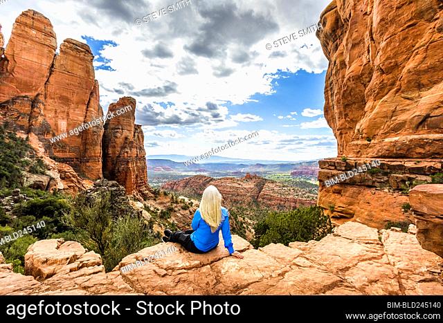 Caucasian woman admiring scenic view in desert landscape