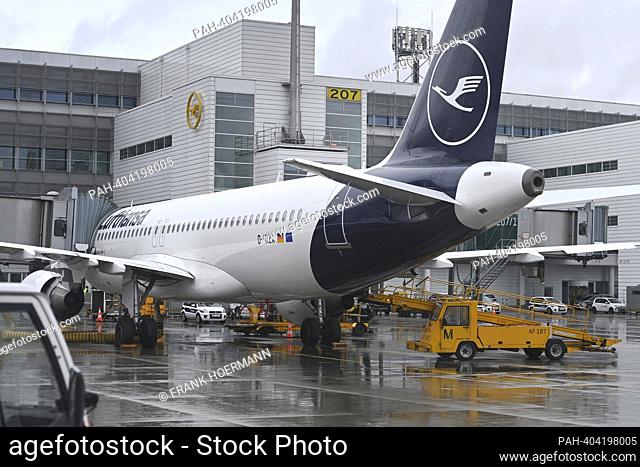 Impressions from Franz Josef Strauss Airport in Munich on April 12, 2023. Lufthansa plane at Terminal 2, parking position at the gate