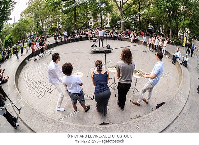 Brian Chase of the Yeah Yeah Yeahs leads percussionists on cymbals at a performance of his work ''Shimmer'' during the summer Make Music New York festival in...