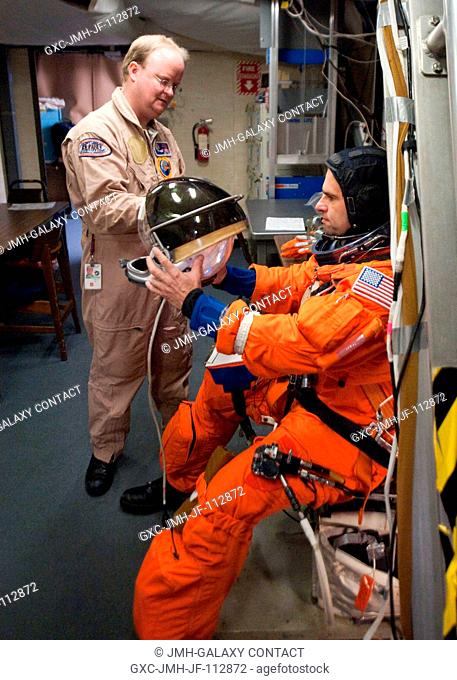 NASA astronaut Greg Chamitoff, STS-134 mission specialist, attired in a training version of his shuttle launch and entry suit