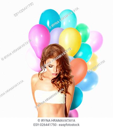 Beauty fashion model girl with colorful balloons isolated