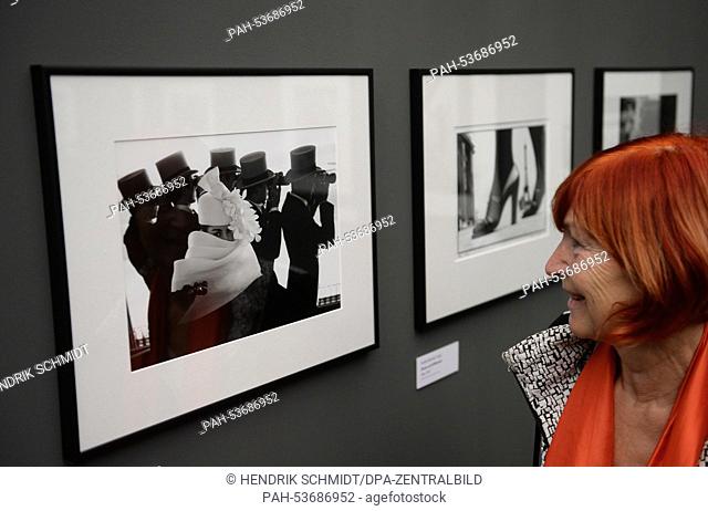 A woman looks at photographs from Frank Horvat at the German Photography Museum in Markkleeberg, Germany, 18 November 2014