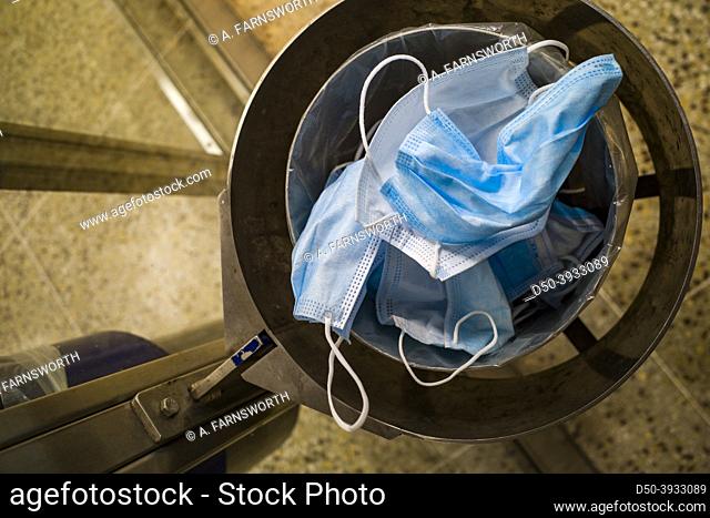 Stockholm, Sweden A pile of discarded face masks in a garbage can in the tunnelbana or subway