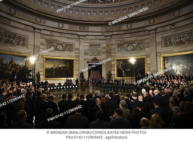 Attendees wait for the remains of former US President George H.W. Bush to arrive at the US Capitol during a State Funeral in Washington, DC, December 3, 2018