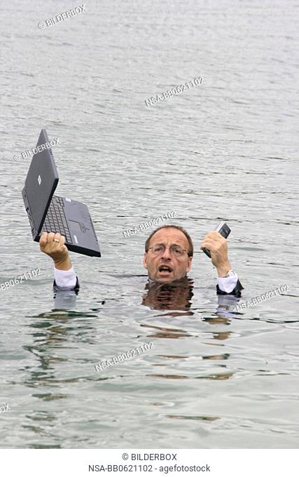 manager stands in deep water