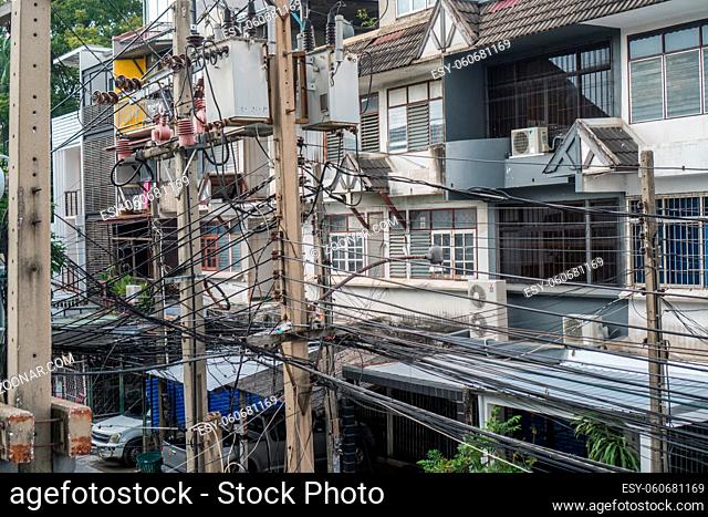 Tangled and messy electrical cables in Bangkok city, Thailand