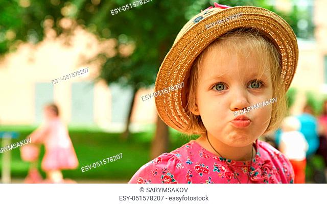 Beautiful little girl in straw hat with long hair looking away in summer  field on sunset, Stock Photo, Picture And Low Budget Royalty Free Image.  Pic. ESY-047575117 | agefotostock