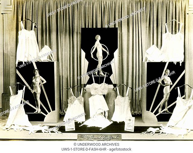 Redding, California: c. 1925 A window display by George Hauber for Redfern corsettes, corselettes, wrap arounds and step-in foundation garments at the...