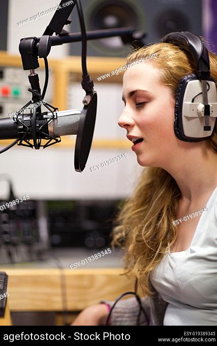 Portrait of a singer recording a track