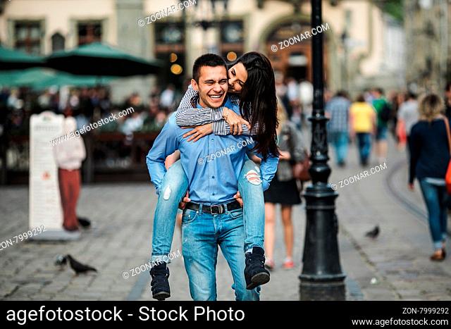 young beautiful couple walking and having fun in the city