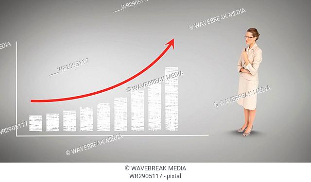 Digital composite image of businesswoman looking at bar graph and arrow