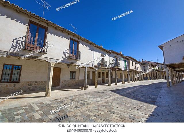 ancient pedestrian medieval street with arcaded buildings, landmark and monument from seventeenth century, in Ampudia village, Palencia, Castile Leon, Spain