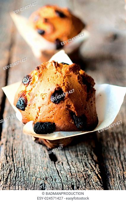 Selectiv focus on the fron muffin with dry cranberries
