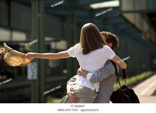 Platform, couple, greedsing, embrace, cheerfully, series, people, love-pair, young, joy, happily, arrives, greedss, welcome, sees again, return, arrival, love