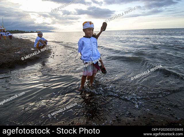 Children play on the beach during the Balinese New Year holiday Nyepi in the northern part of the island of Bali, March 19, 2023, Lokapaksa, Buleleng, Indonesia