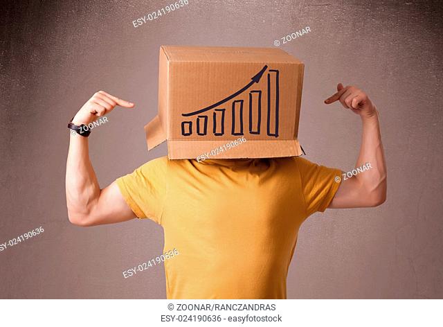 Young man gesturing with a cardboard box on his head with diagram