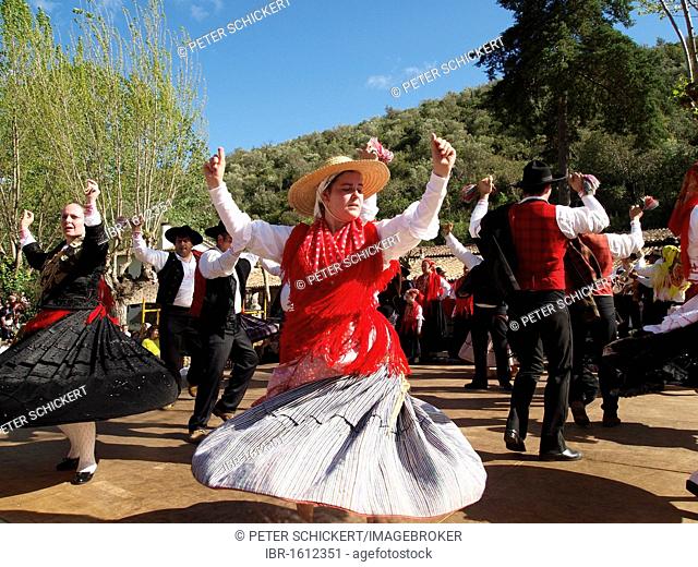 Portuguese folk dancers in traditional costume at the Festa da Fonte Grande May festival in Alte, Algarve, Portugal, Europe