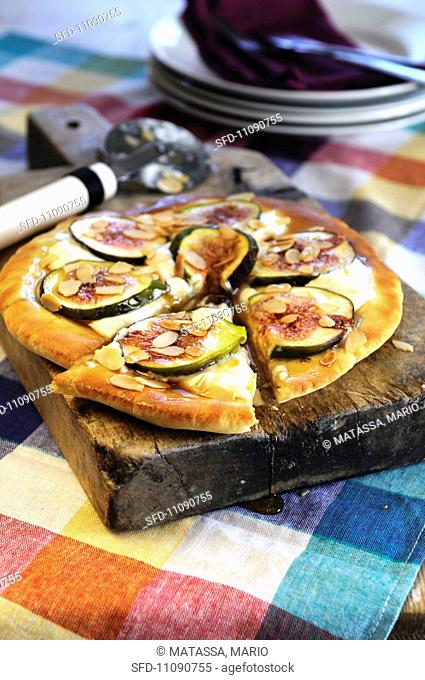 Mascarpone and fresh fig sweet pizza drizzled with honey