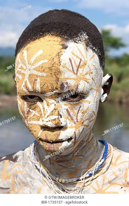 Surma boy with facial and body painting, Kibish, Omo River Valley, Ethiopia, Africa