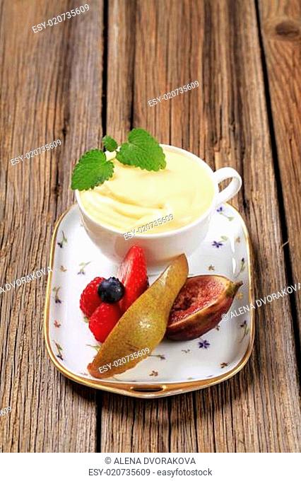 Bowl of pudding and fresh fruit