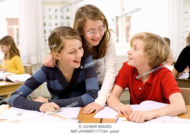 Children studying and laughing