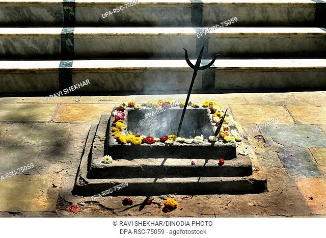 Havan Kund or Yagya kund with Trishul , the weapon of Lord Shiva , at Kal Bhairava temple , mentioned in the Avanti Khanda of Skanda Purana