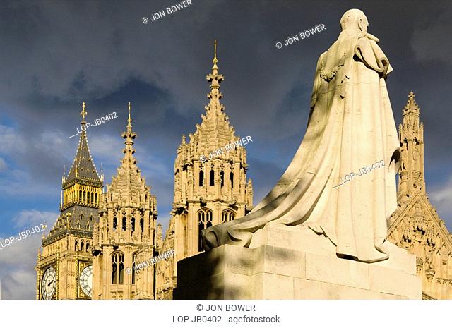 England, London, Westminster, The statue of George V in front of Westminster Abbey with storm clouds brewing
