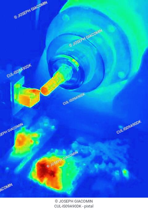 Thermal image of turning a part on a lathe, showing heat buildup on cutting tool and shavings