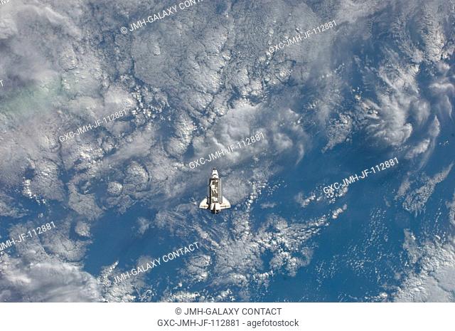 One of the Expedition 27 crew members aboard the International Space Station (ISS) recorded this image of the distant space shuttle Endeavour