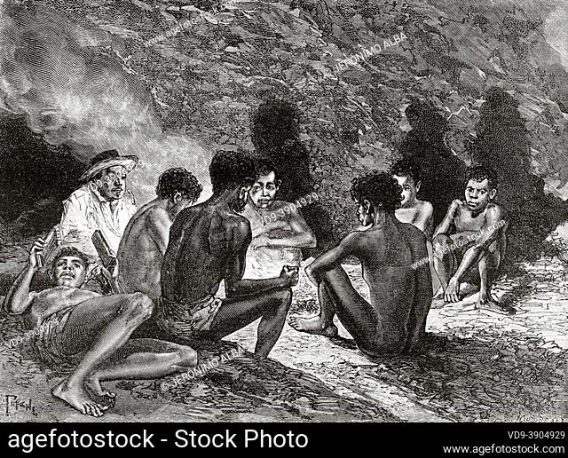 Indigenous Australian Aborigines in a cave around a bonfire. Queensland, Australia. Old 19th century engraved illustration