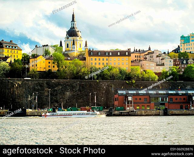 Beautiful buildings of Stockholm Sweden and the tourist boat sailing on the lake