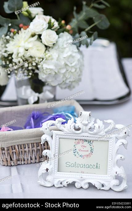 decorated table and basket with heel taps for a wedding reception