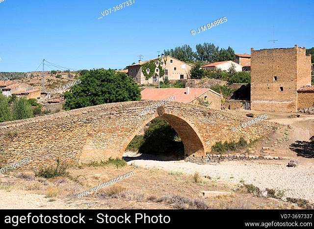 Pobla de Bellestar or Sant Miquel de la Pobla. Gothic bridge 13th century over De Las Truchas river and fortified farmhouse