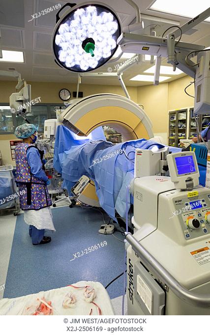 Englewood, Colorado - A CT scan machine, the Stealth O-arm spinal navigation, is used to obtain imaging before a surgical team performs minimally invasive...