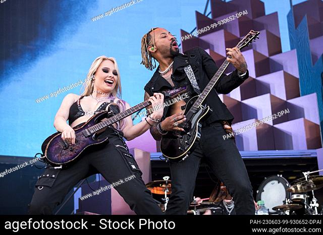 03 June 2023, Bavaria, Nuremberg: Guitarist Sophie Lloyd (l) and guitarist Justin ""Jus"" Lyons (r) during the performance of the band Machine Gun Kelly on the...