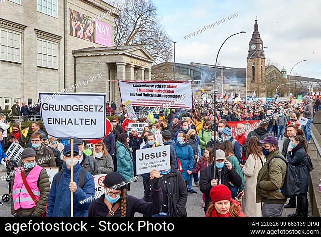 26 March 2022, Hamburg: Participants of the demonstration ""We protect the Constitution! Immediate end to the state of emergency and all pandemic measures