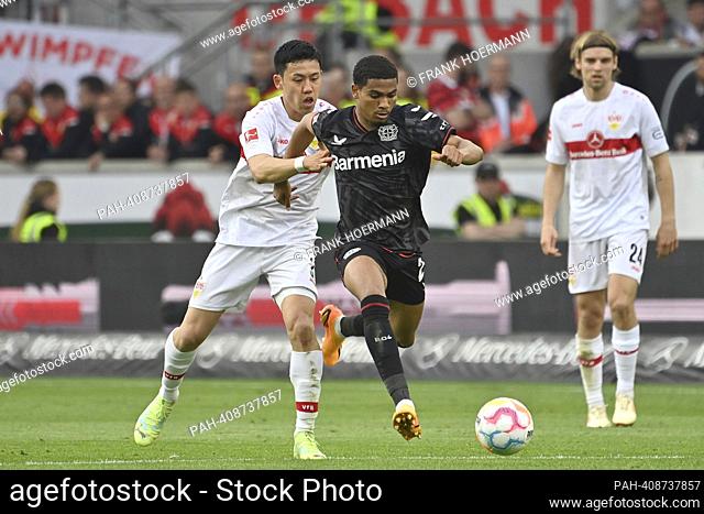 Wataru ENDO (VFB Stuttgart) action, duels versus Amine ADLI (Bayer Leverkusen) . Football 1st Bundesliga season 2022/2023, 32nd matchday, matchday32