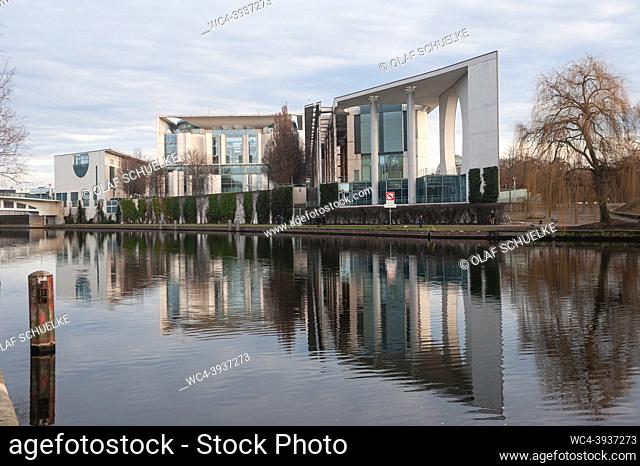 Berlin, Germany, Europe - View from the bank of the Spree River at the German Chancellery building in Mitte that is reflected in the river