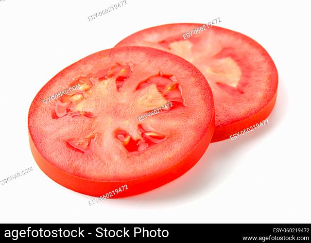 Two slices of tomato isolated over white background