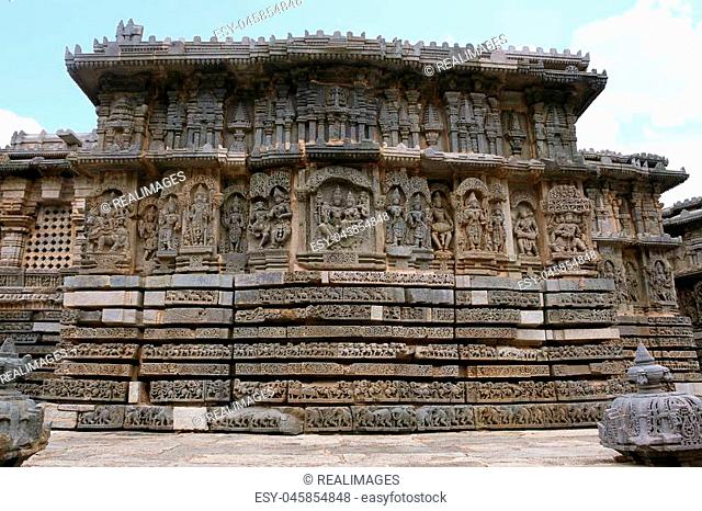 Ornate bas relieif and sculptures of Hindu deities, North wall, Kedareshwara Temple, Halebid, Karnataka, India