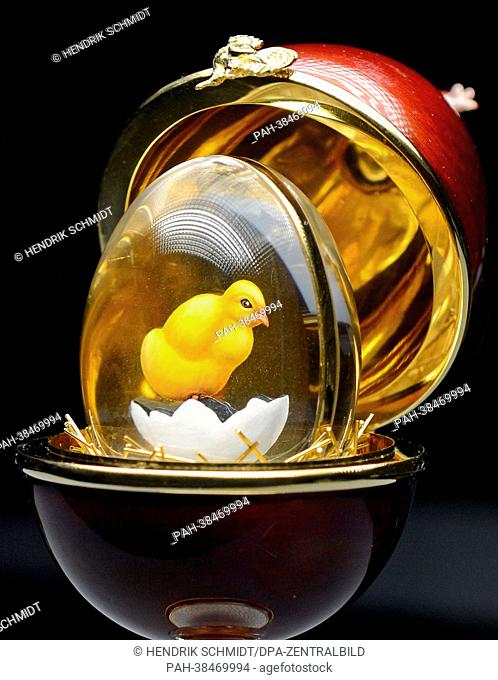 A chick sits in a magnificant egg which is on display at the new special exhibition 'Precious Egg Creations' at terra mineralia in Freiberg, Germany
