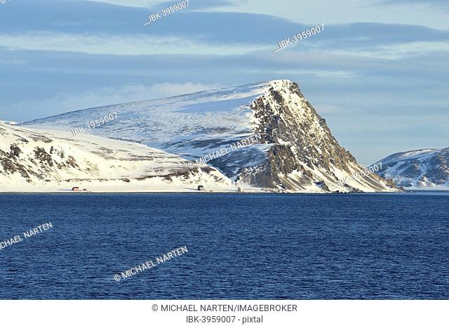 Norwegian Sea and island coast with buildings, Magerøya island, Finnmark County, Norway