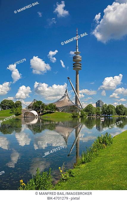 Olympic park with Olympic tower, tent roof, lake stage and theatron as well as Olympic lake, cloudy sky, Munich, Upper Bavaria, Bavaria, Germany
